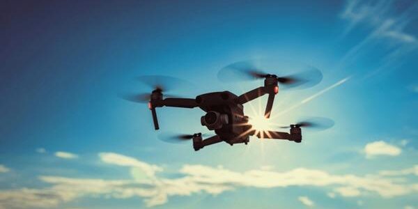 dark-silhouette-quadcopter-drone-hovers dark-silhouette-quadcopter-drone-hovers