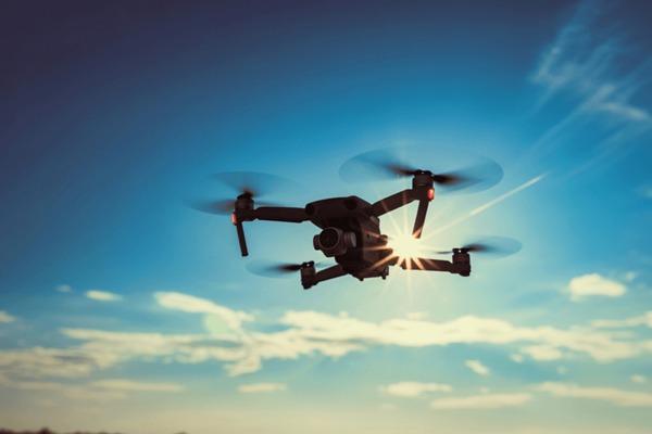 dark-silhouette-quadcopter-drone-hovers dark-silhouette-quadcopter-drone-hovers